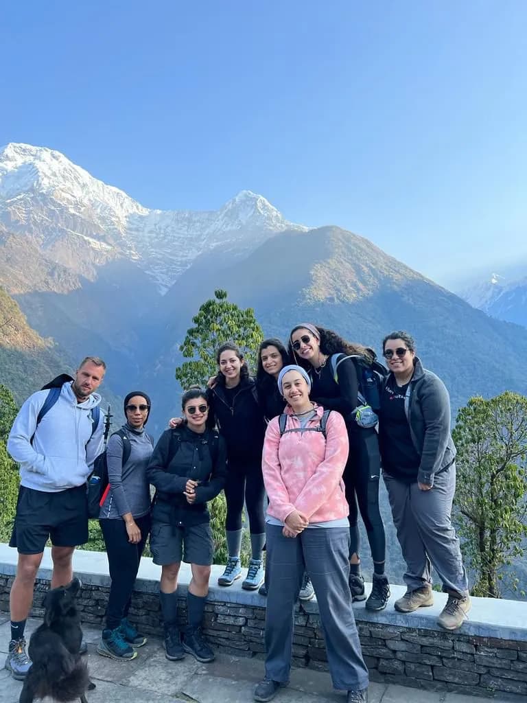 A group photo of Everest Thrill's Happy Clients infront of Mount Annapurna